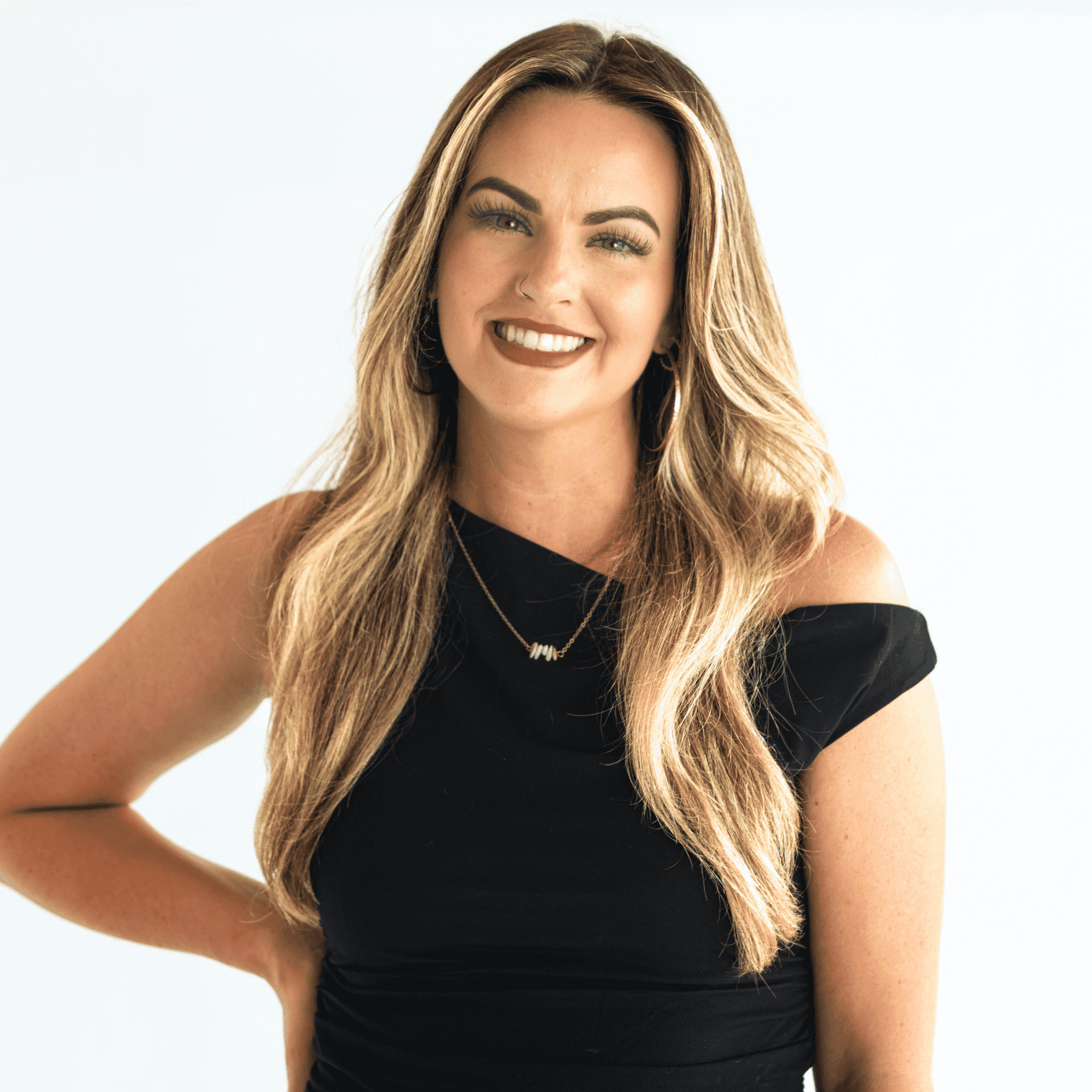 Portrait of Bekah Davis, a professional stylist at The Capital Salon & Suites, showcasing their expertise and style.