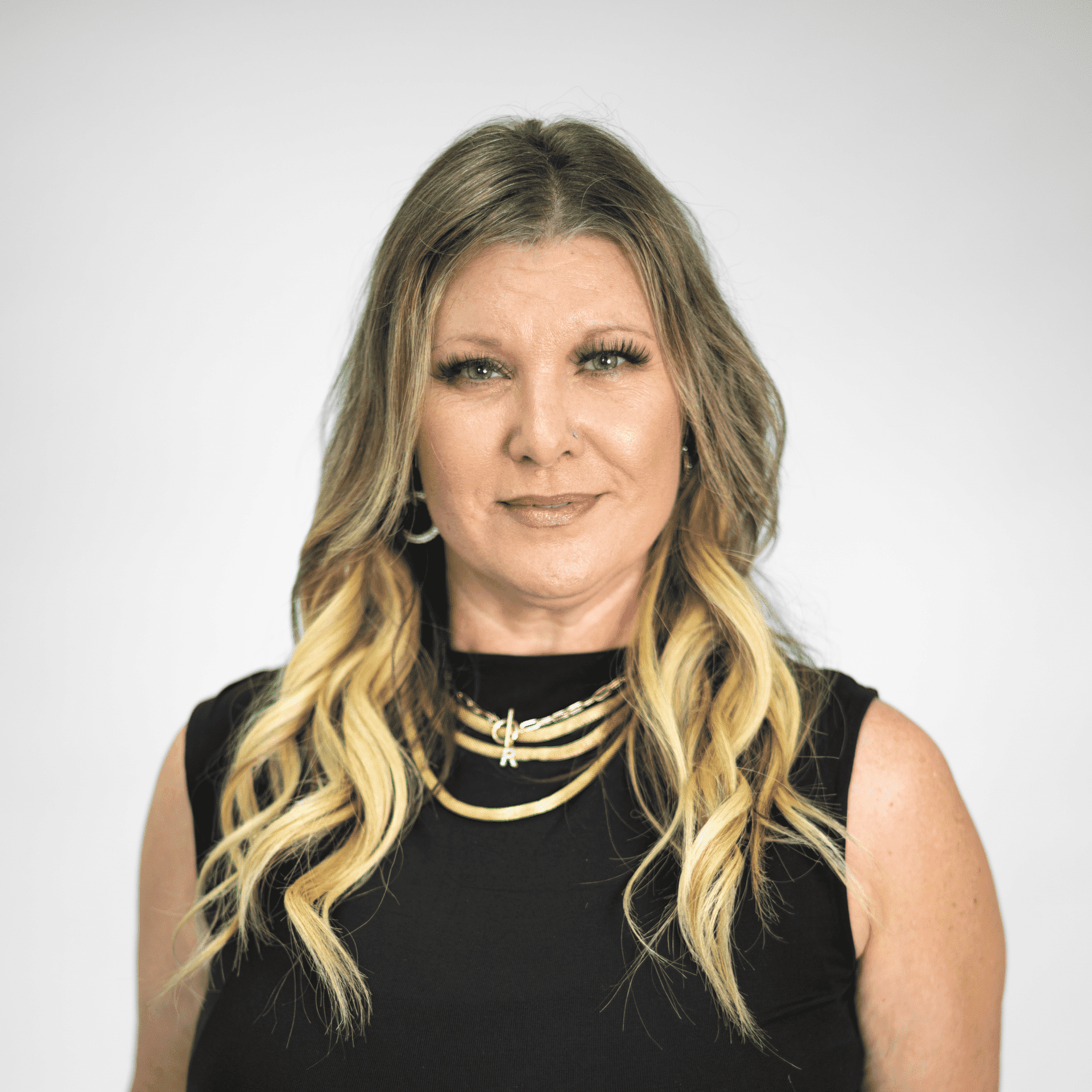 Portrait of Rhonda Sullivan, a professional stylist at The Capital Salon & Suites, showcasing their expertise and style.