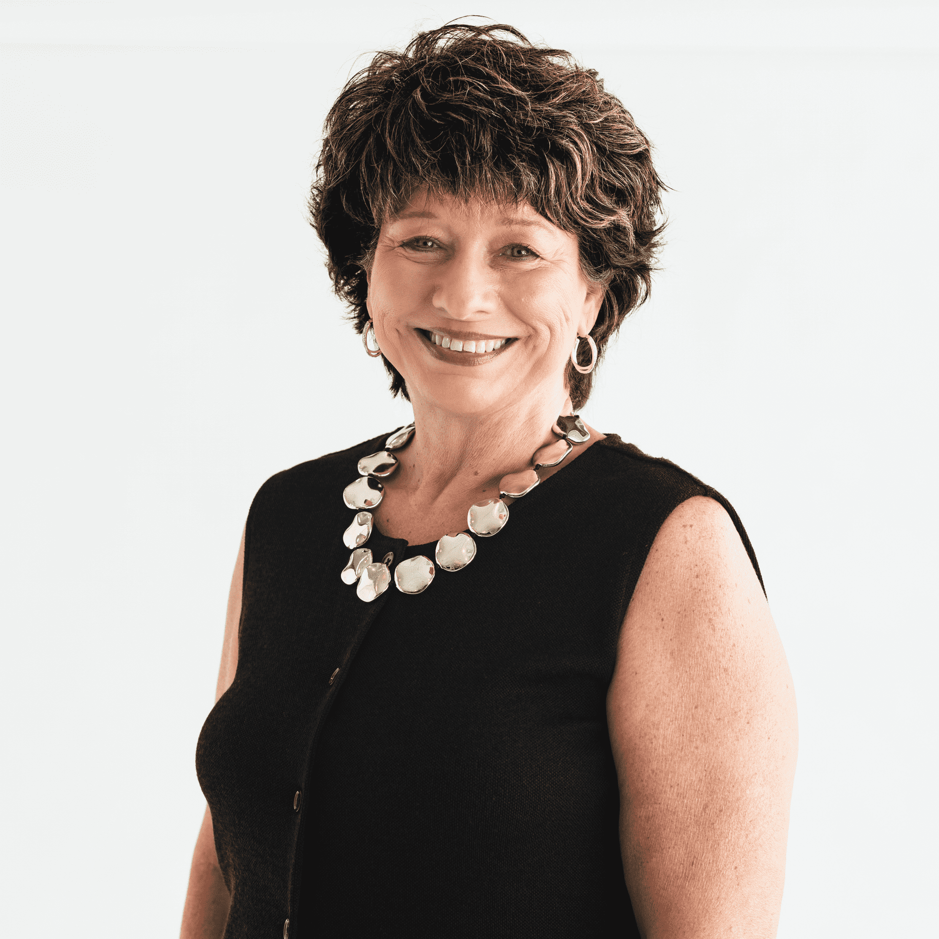 Portrait of Becky Reed, a professional stylist at The Capital Salon & Suites, showcasing their expertise and style.