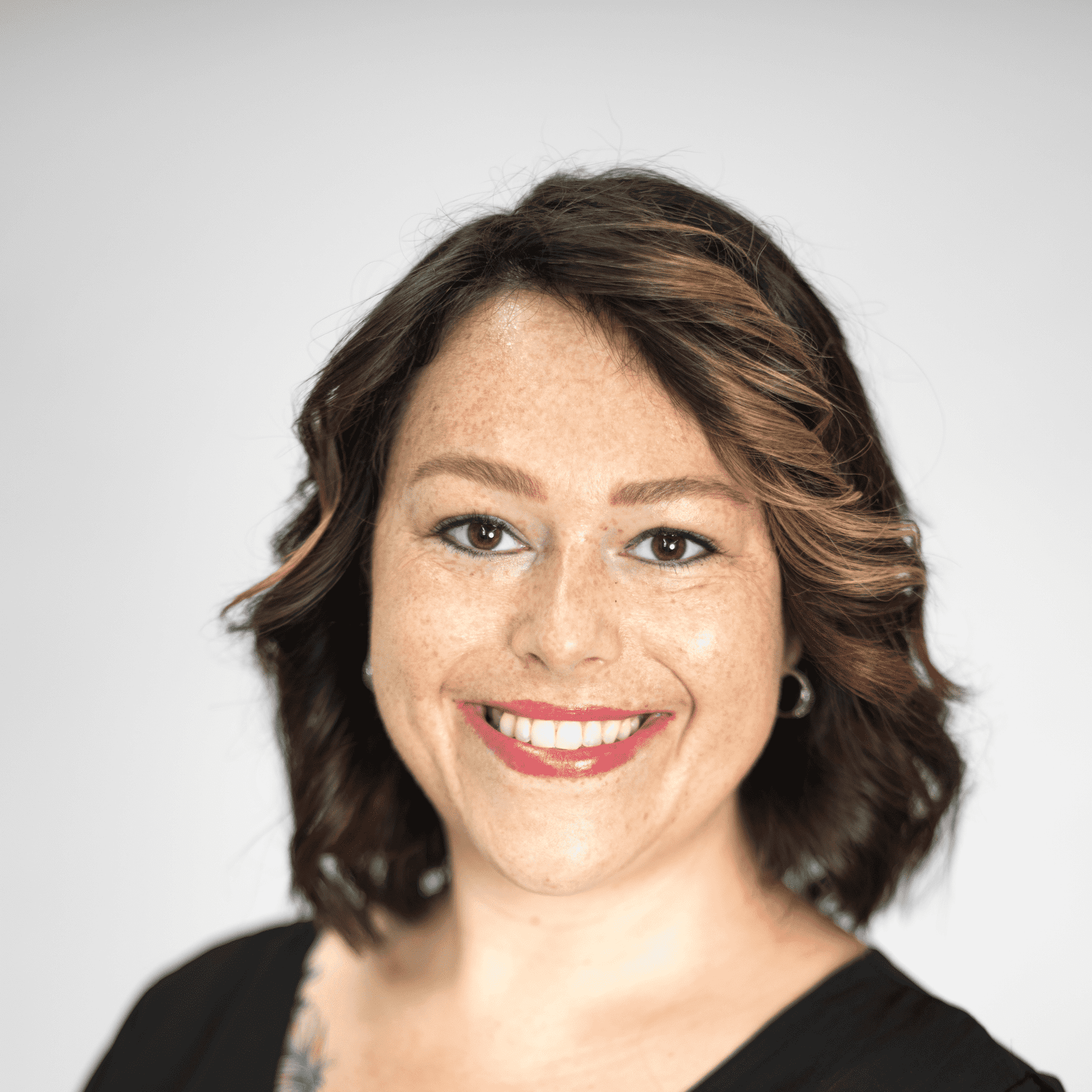 Portrait of Maranda Negrete, a professional stylist at The Capital Salon & Suites, showcasing their expertise and style.