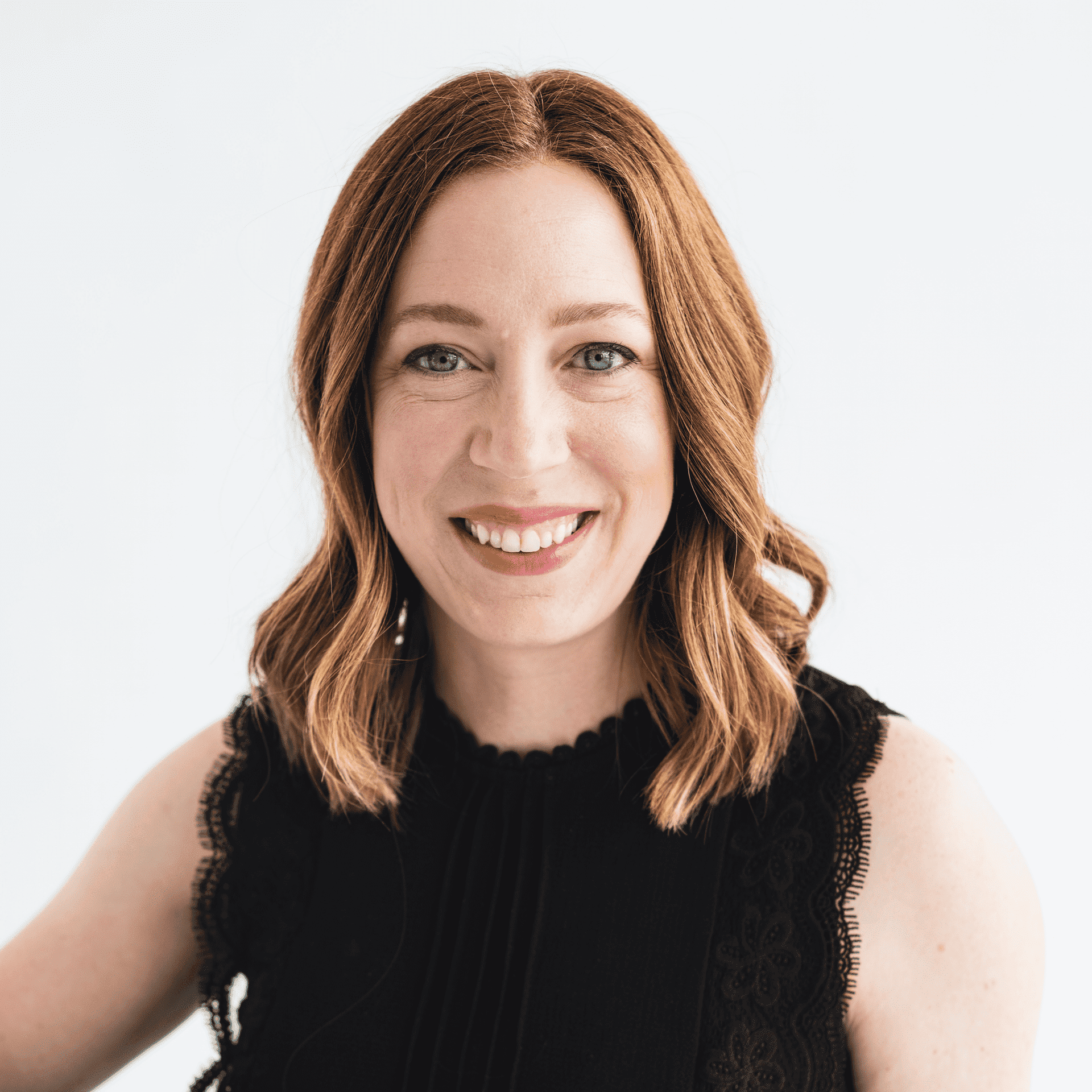 Portrait of Cassie Wyatt, a professional stylist at The Capital Salon & Suites, showcasing their expertise and style.