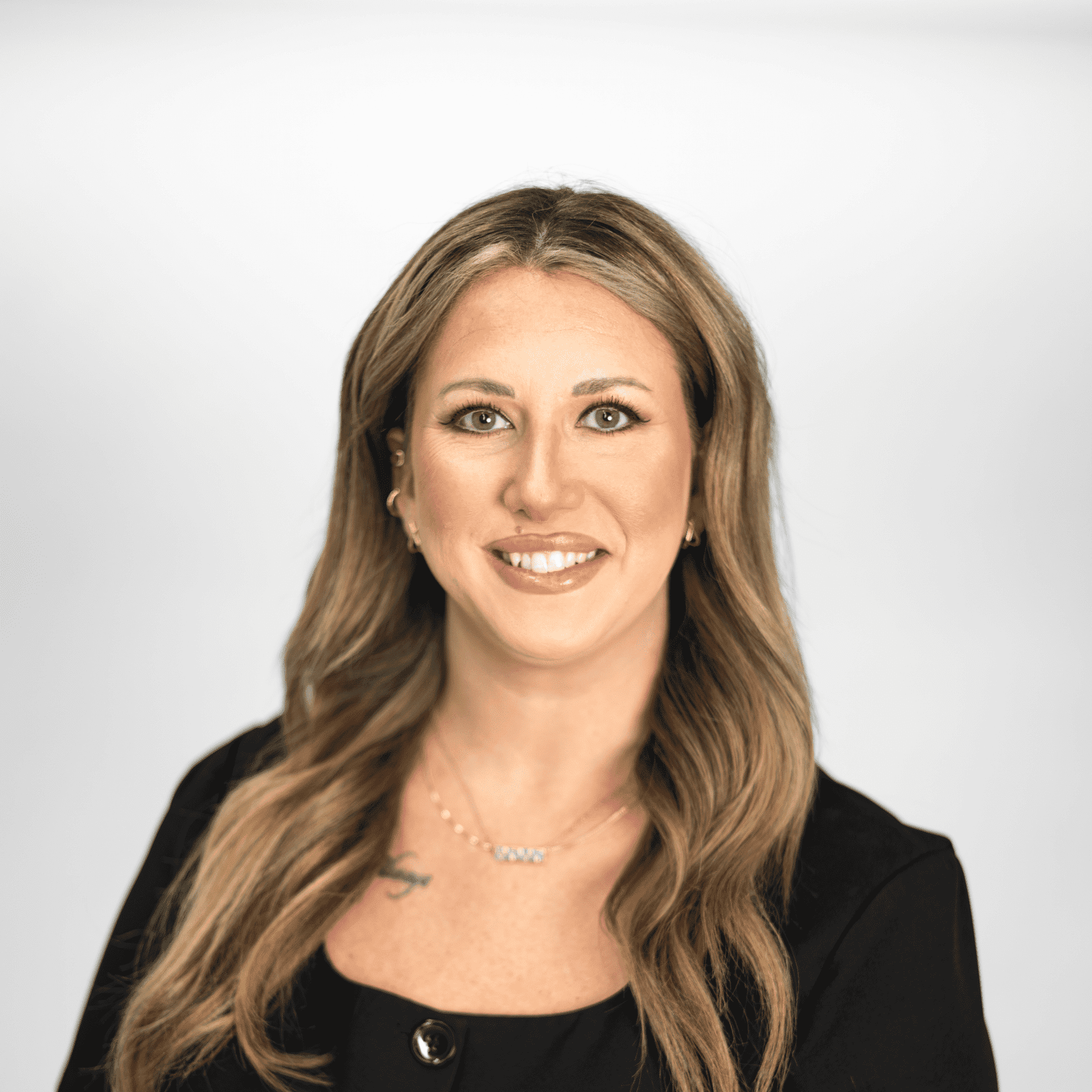 Portrait of Shyla Rogers, a professional stylist at The Capital Salon & Suites, showcasing their expertise and style.