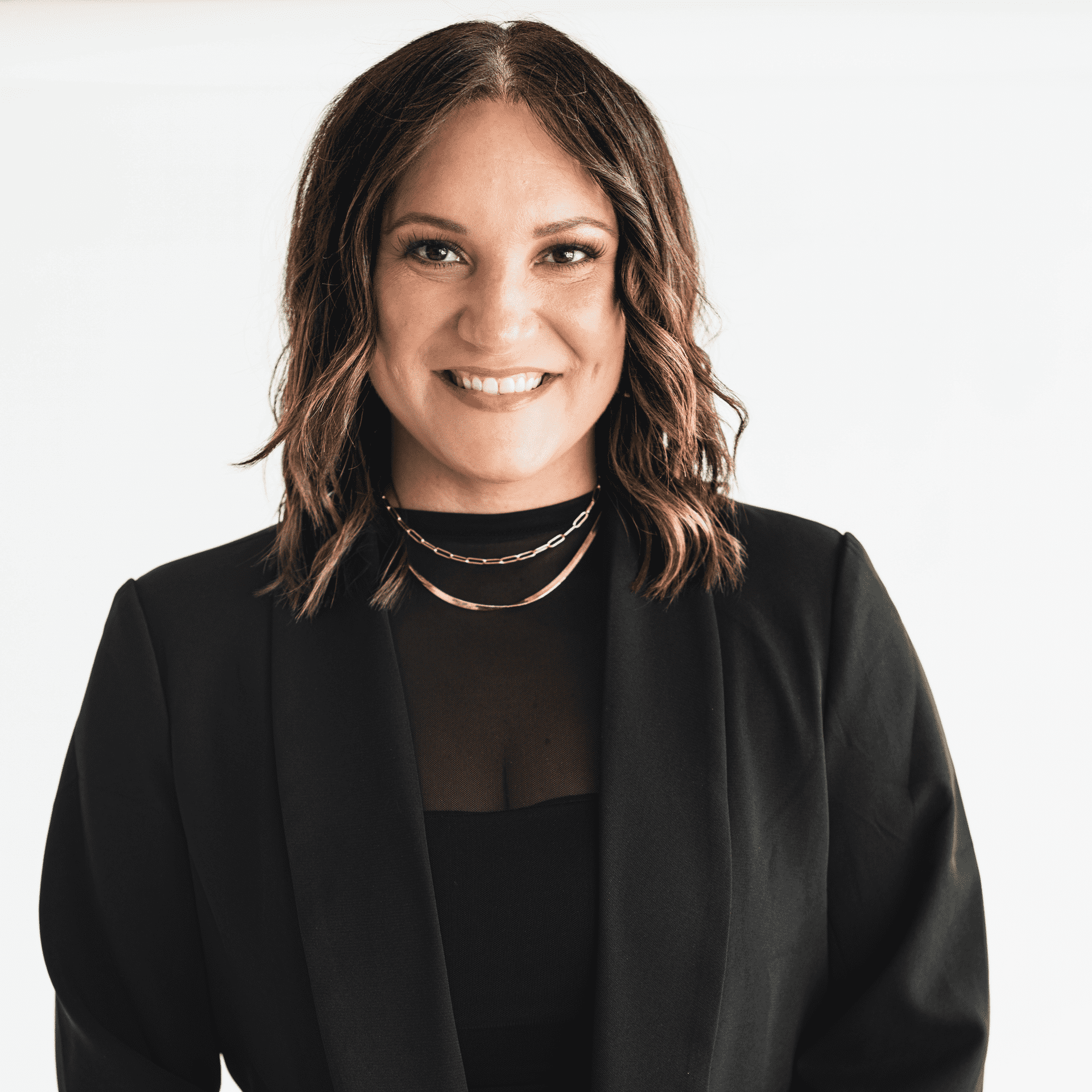 Portrait of Emily Paroubek, a professional stylist at The Capital Salon & Suites, showcasing their expertise and style.