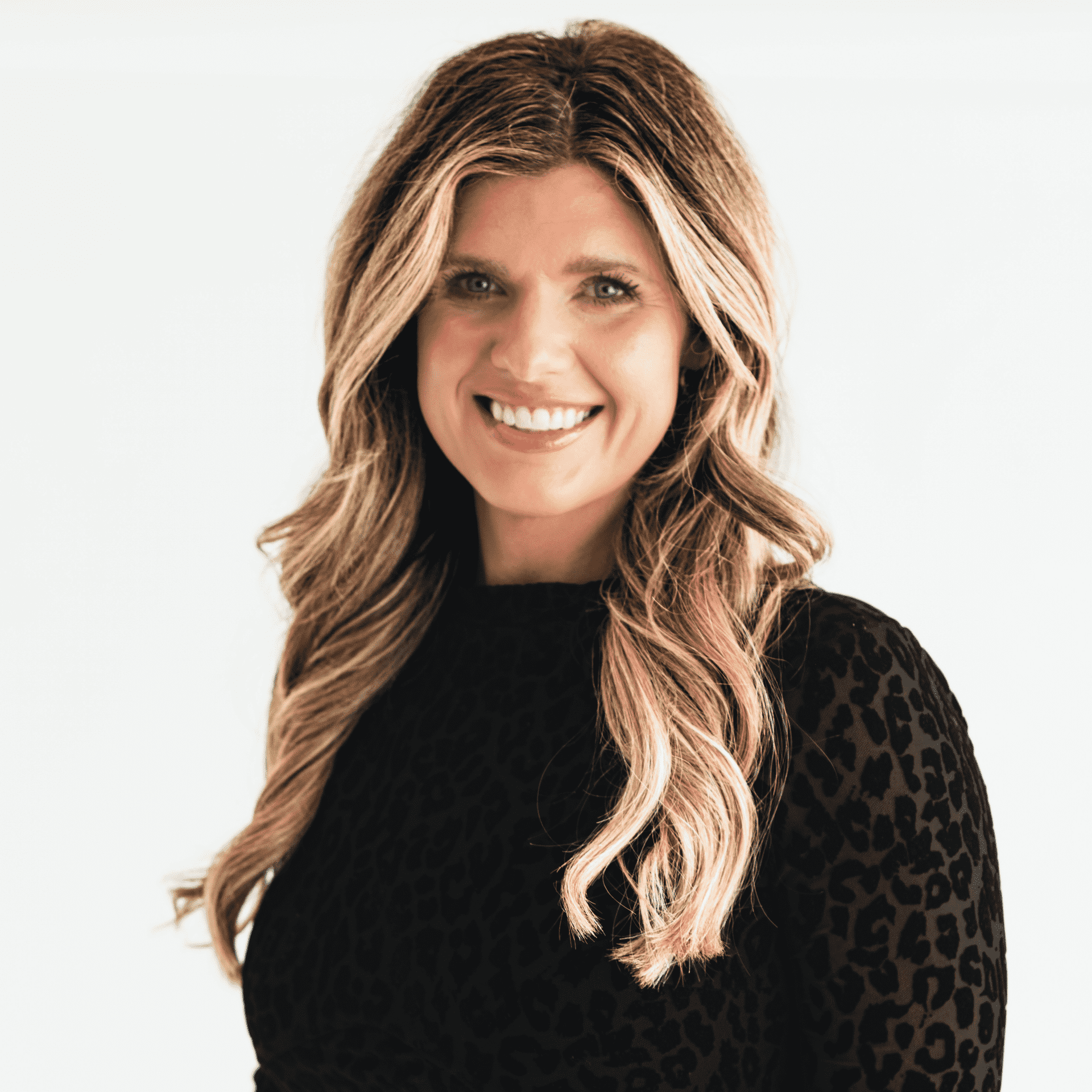 Portrait of Kaylynn Bauer, a professional stylist at The Capital Salon & Suites, showcasing their expertise and style.