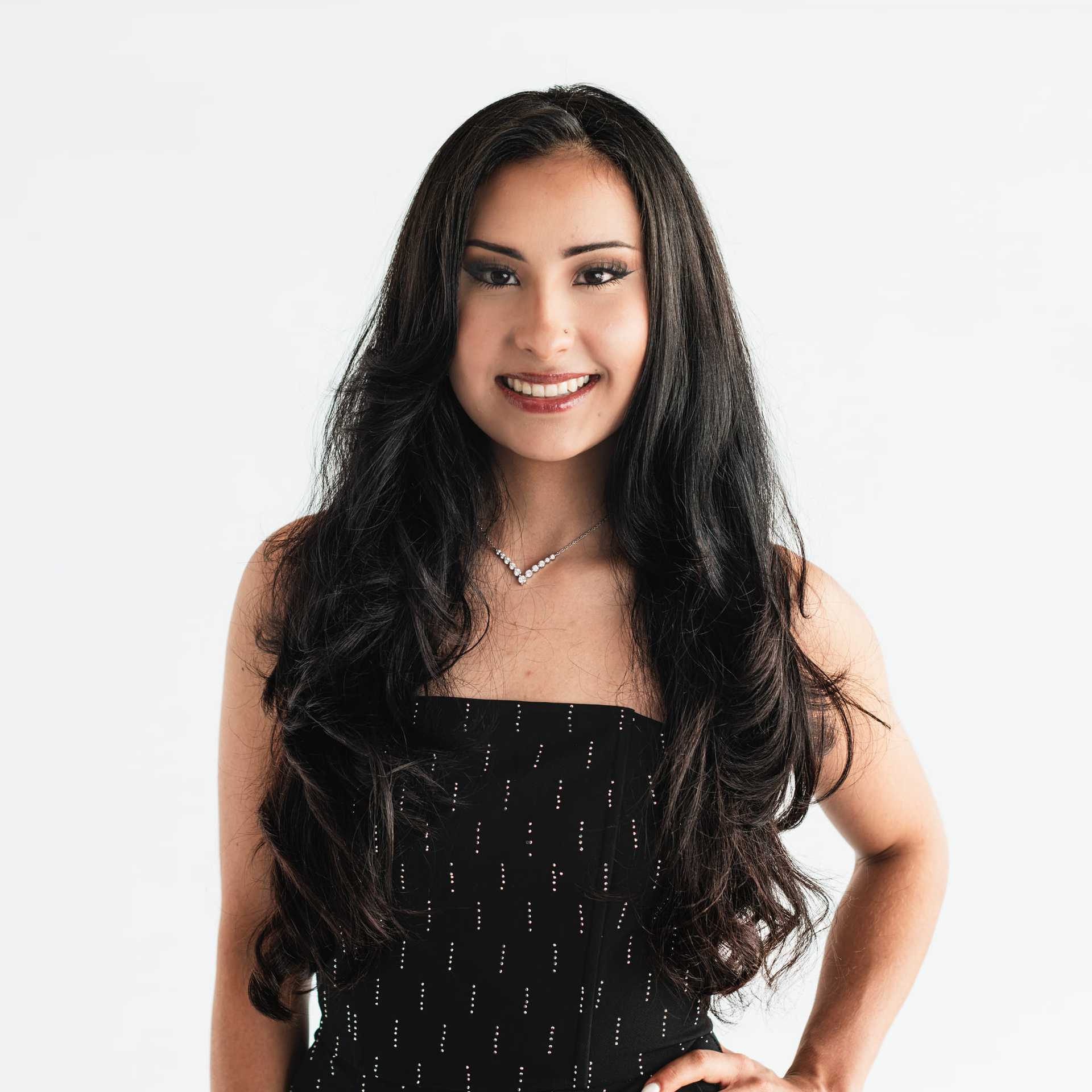 Portrait of Lauren Monterroso, a professional stylist at The Capital Salon & Suites, showcasing their expertise and style.