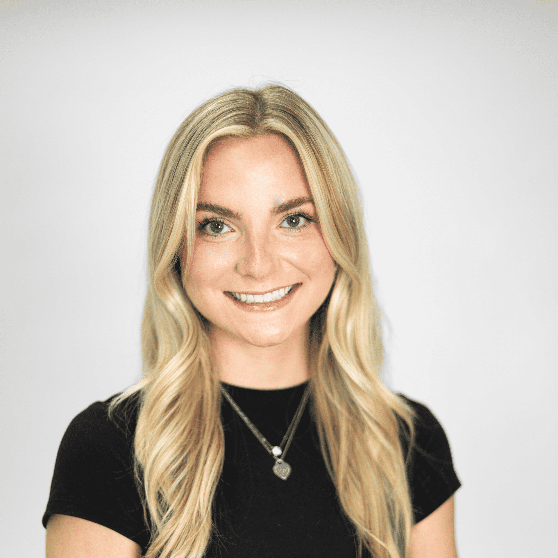 Portrait of Camryn Gentry, a professional stylist at The Capital Salon & Suites, showcasing their expertise and style.