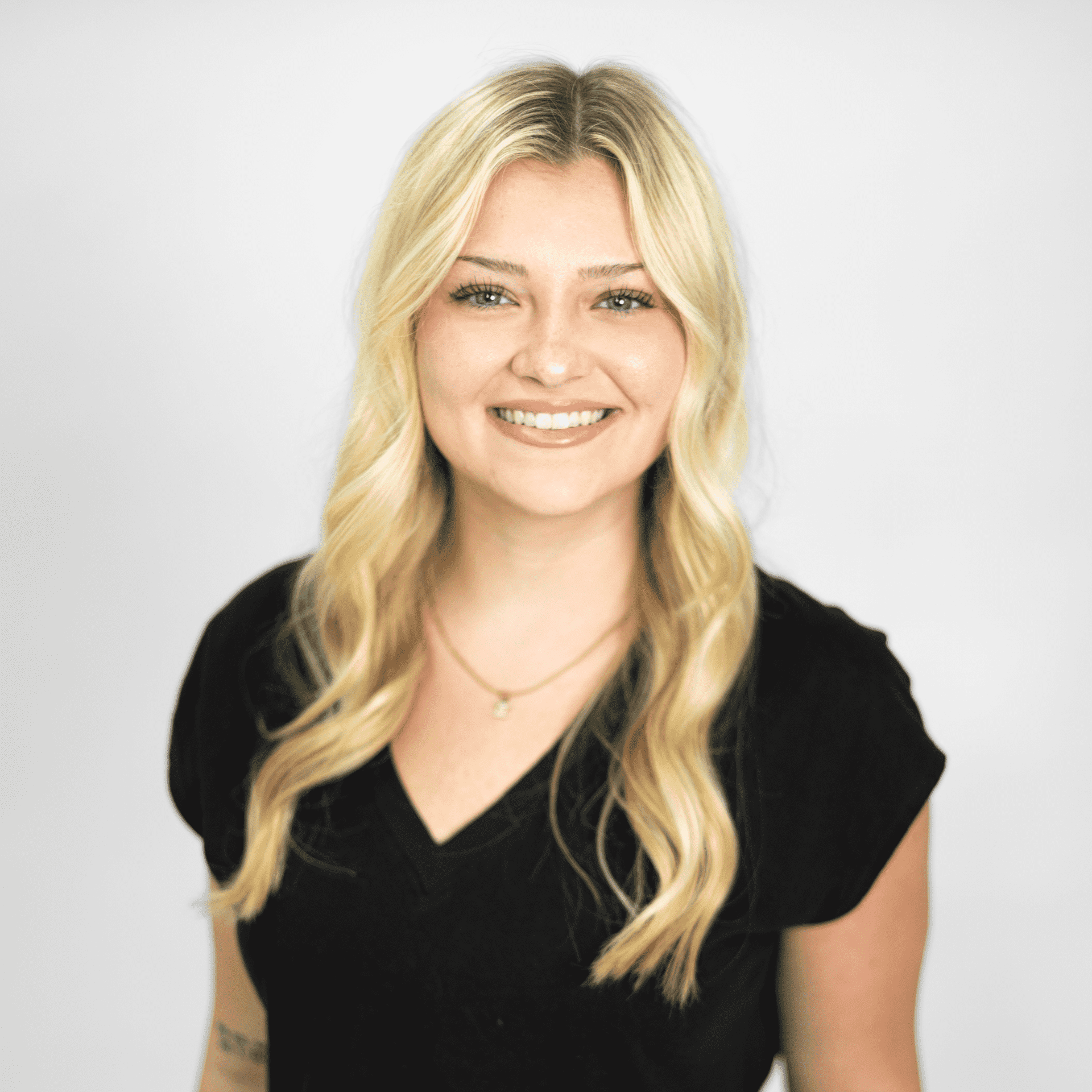 Portrait of Maci Pollard, a professional stylist at The Capital Salon & Suites, showcasing their expertise and style.