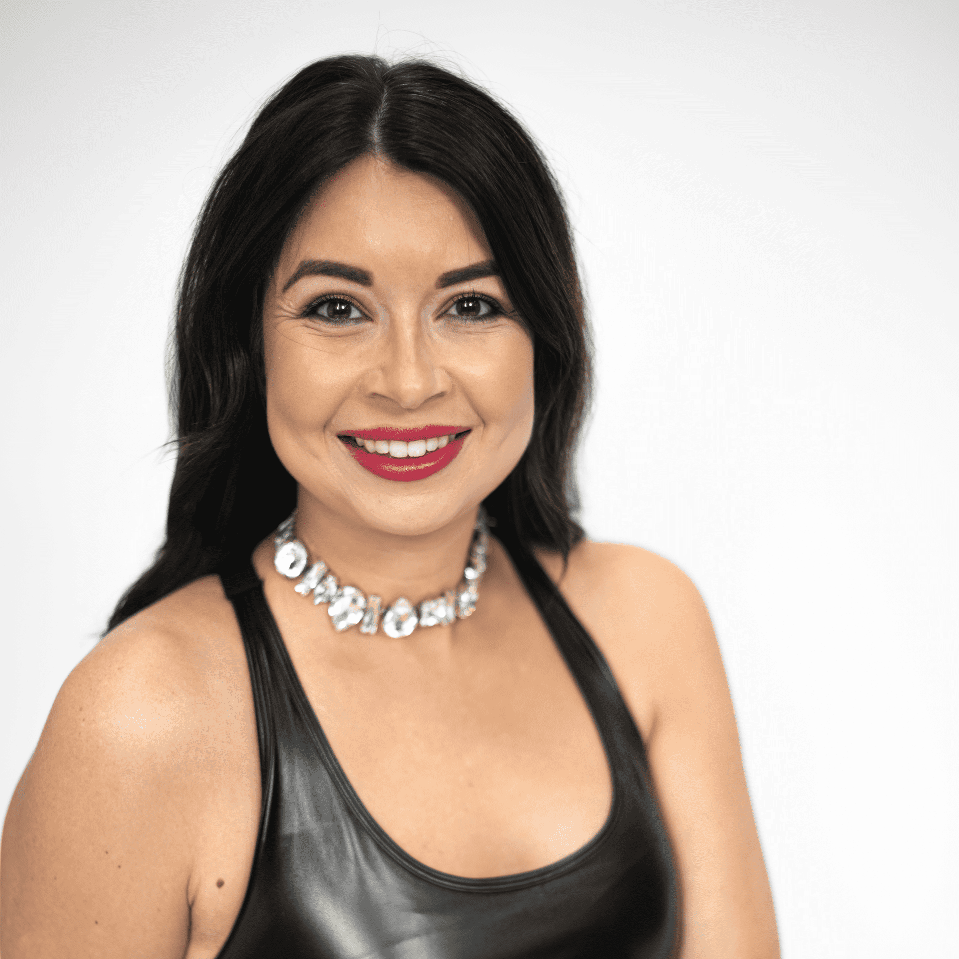 Portrait of Sarah Coulbourn, a professional stylist at The Capital Salon & Suites, showcasing their expertise and style.