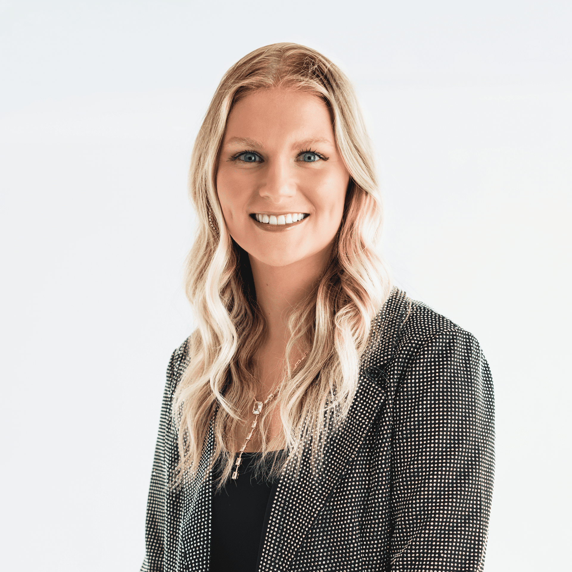 Portrait of Hannah Frakes, a professional stylist at The Capital Salon & Suites, showcasing their expertise and style.