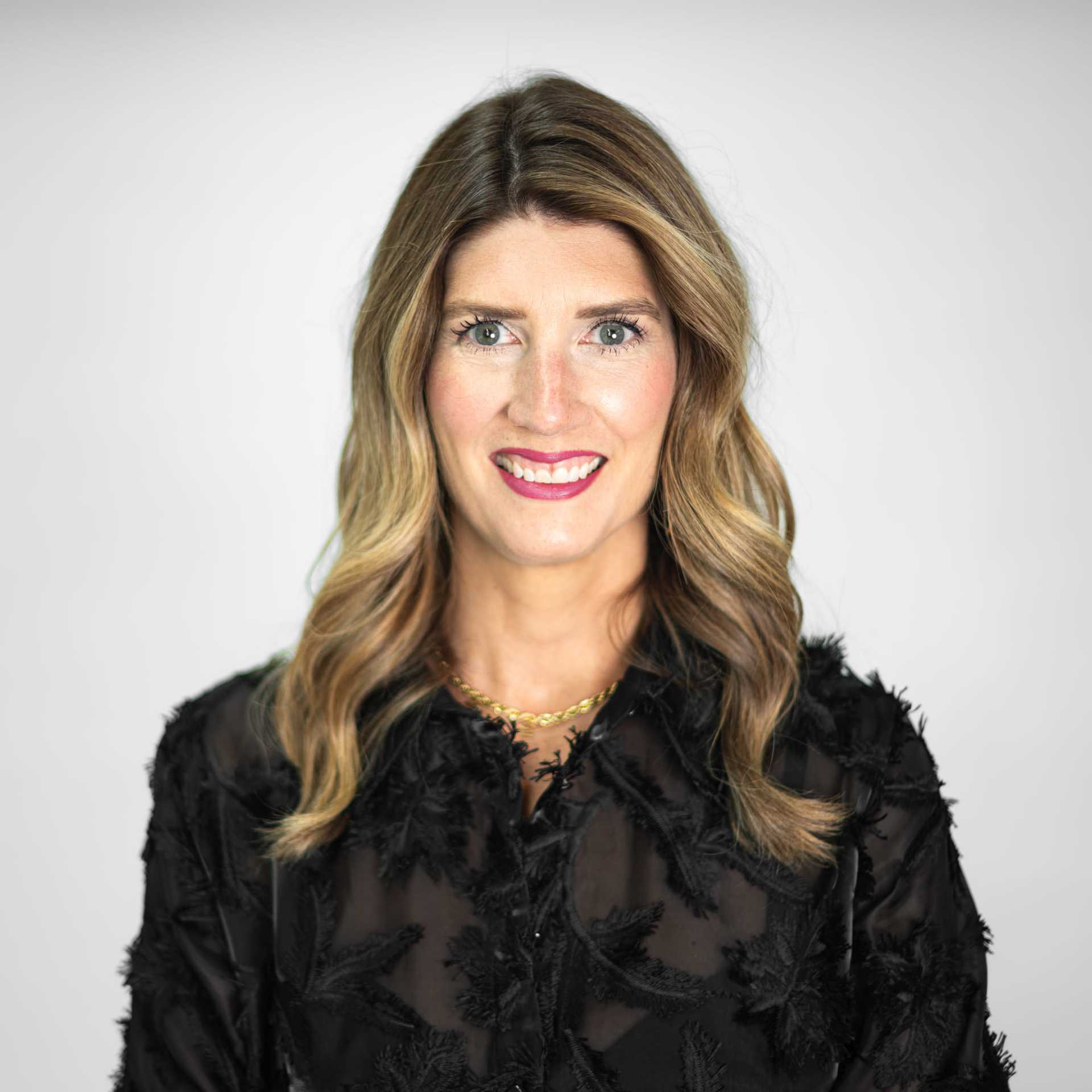 Portrait of Emily Dunn, a professional stylist at The Capital Salon & Suites, showcasing their expertise and style.