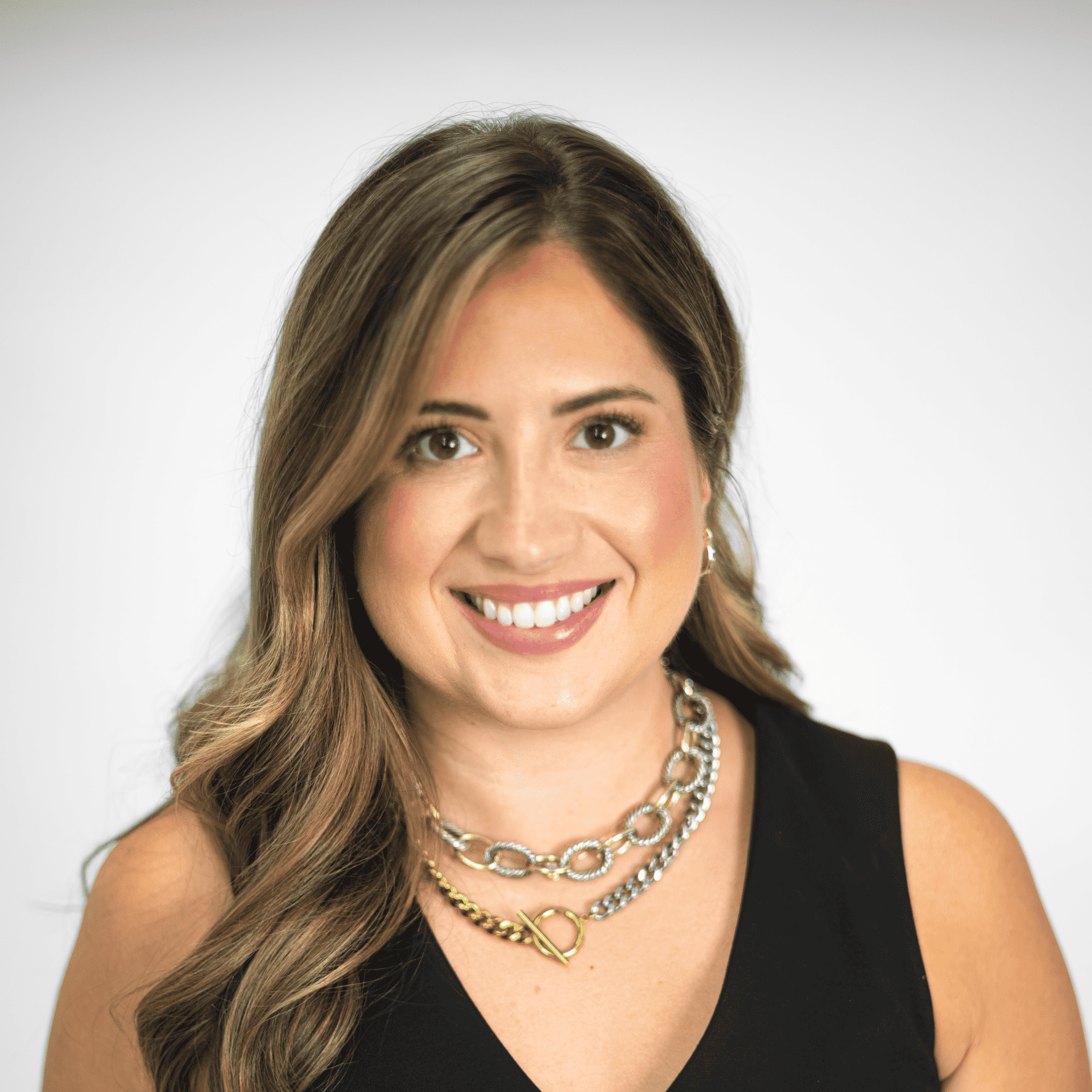 Portrait of Catelyn Hooser, a professional stylist at The Capital Salon & Suites, showcasing their expertise and style.