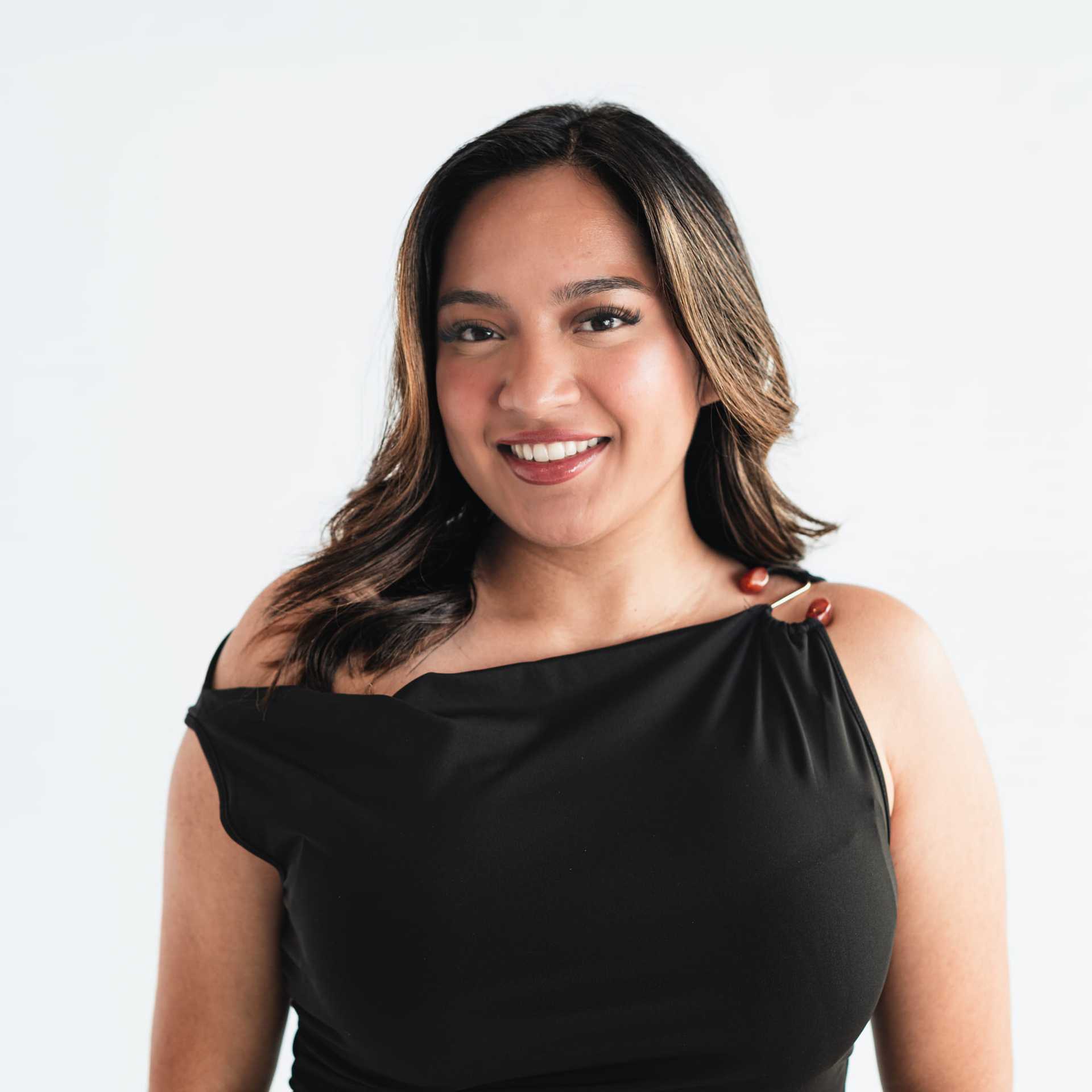 Portrait of Andrea Gonzalez, a professional stylist at The Capital Salon & Suites, showcasing their expertise and style.