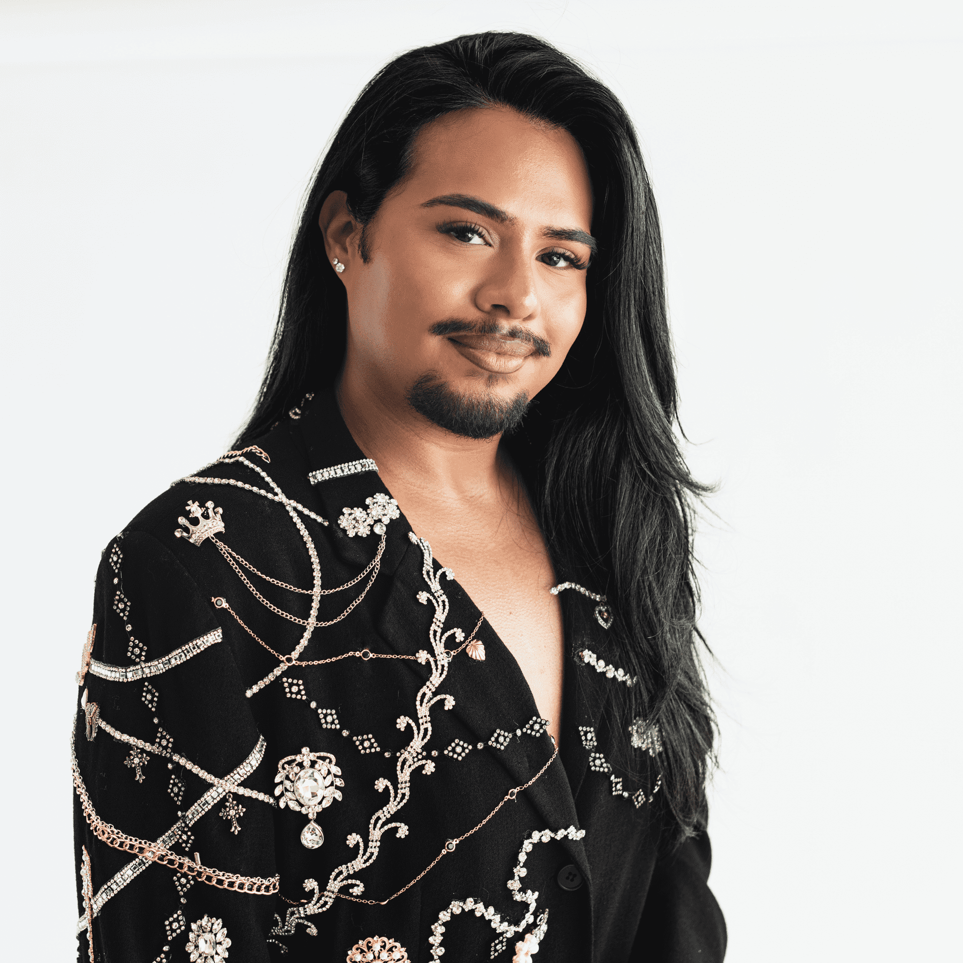 Portrait of Jaime Lemus, a professional stylist at The Capital Salon & Suites, showcasing their expertise and style.