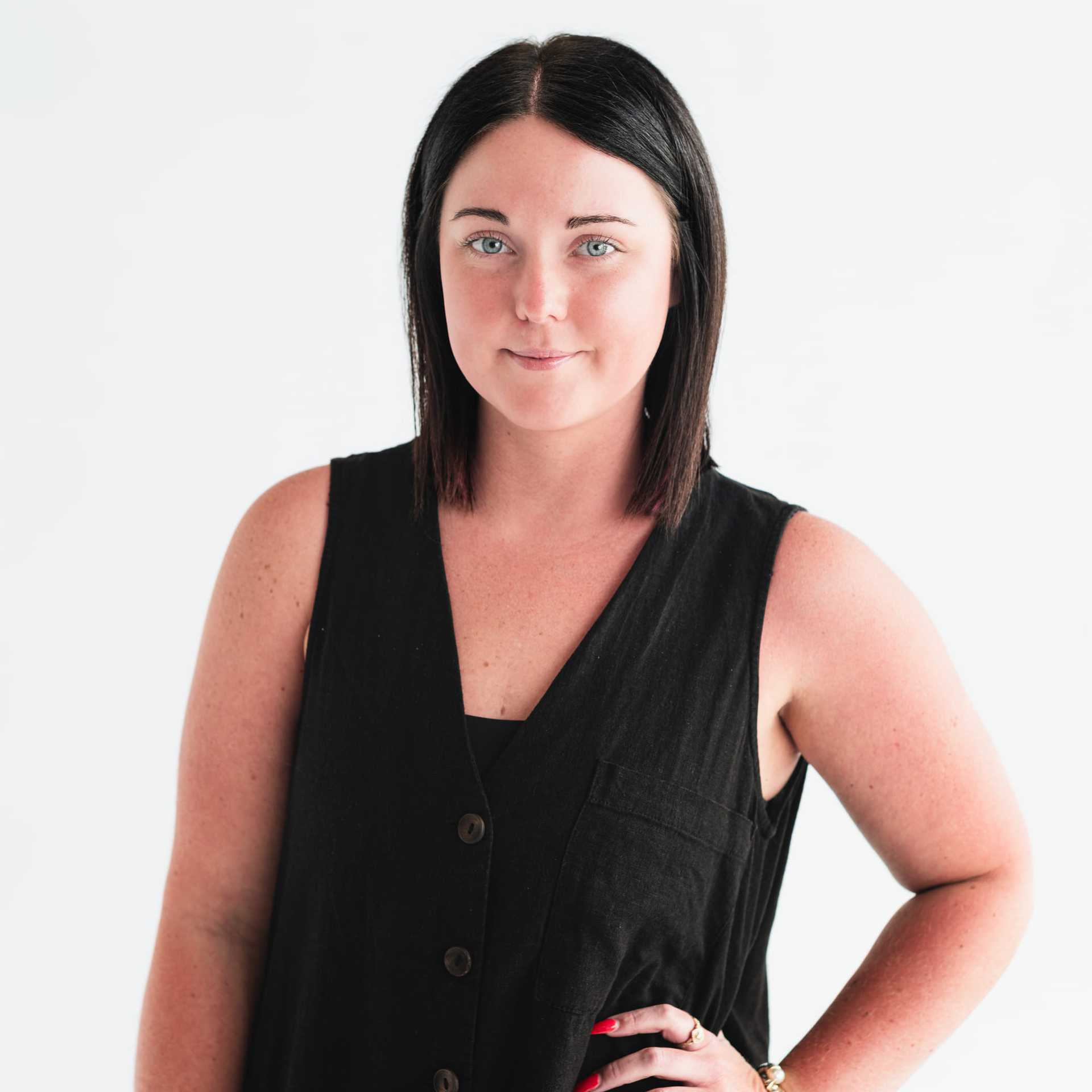 Portrait of Olivia Chapman, a professional stylist at The Capital Salon & Suites, showcasing their expertise and style.