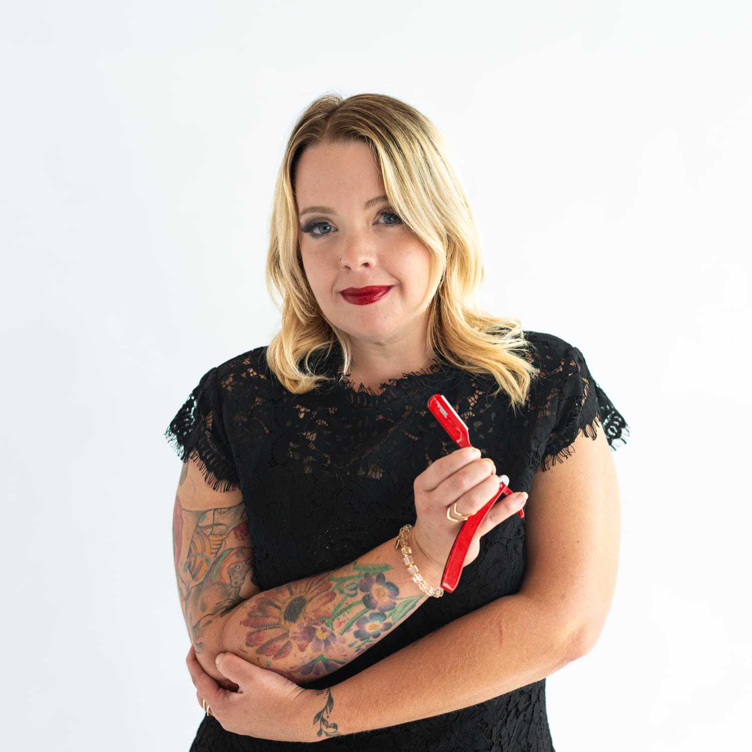 Portrait of Eden Thompson, a professional stylist at The Capital Salon & Suites, showcasing their expertise and style.