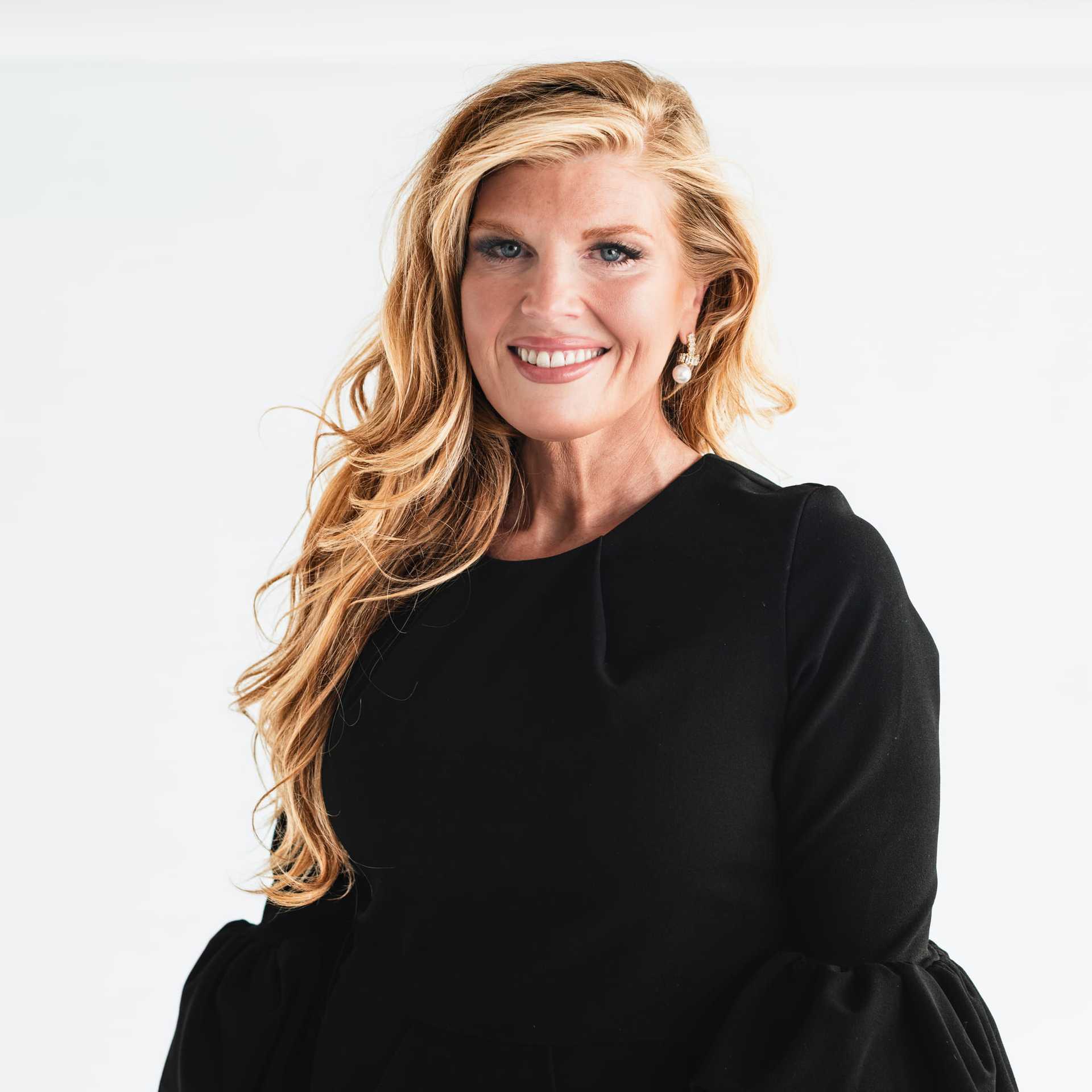 Portrait of Libbey Haney, a professional stylist at The Capital Salon & Suites, showcasing their expertise and style.