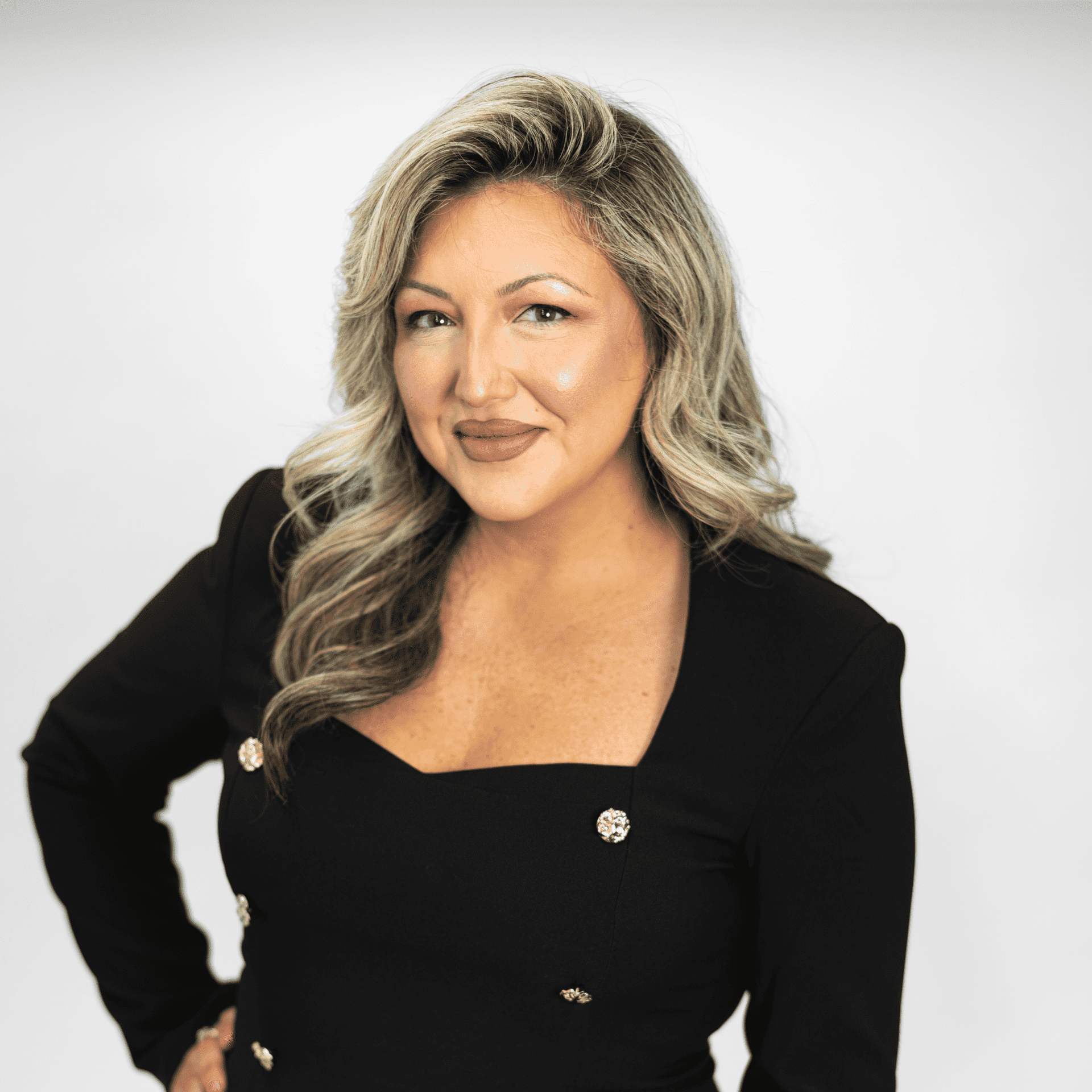 Portrait of Janelle Ezell, a professional stylist at The Capital Salon & Suites, showcasing their expertise and style.