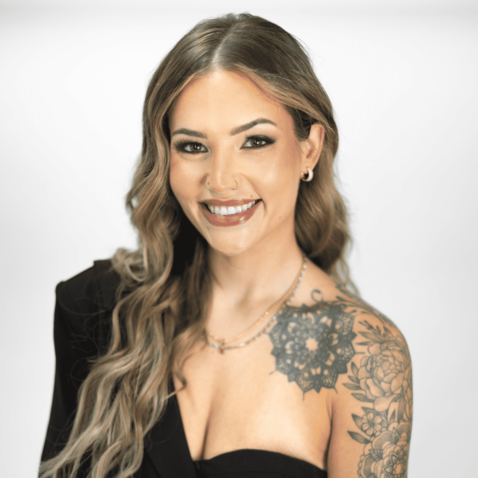 Portrait of Taylor Battenfield, a professional stylist at The Capital Salon & Suites, showcasing their expertise and style.
