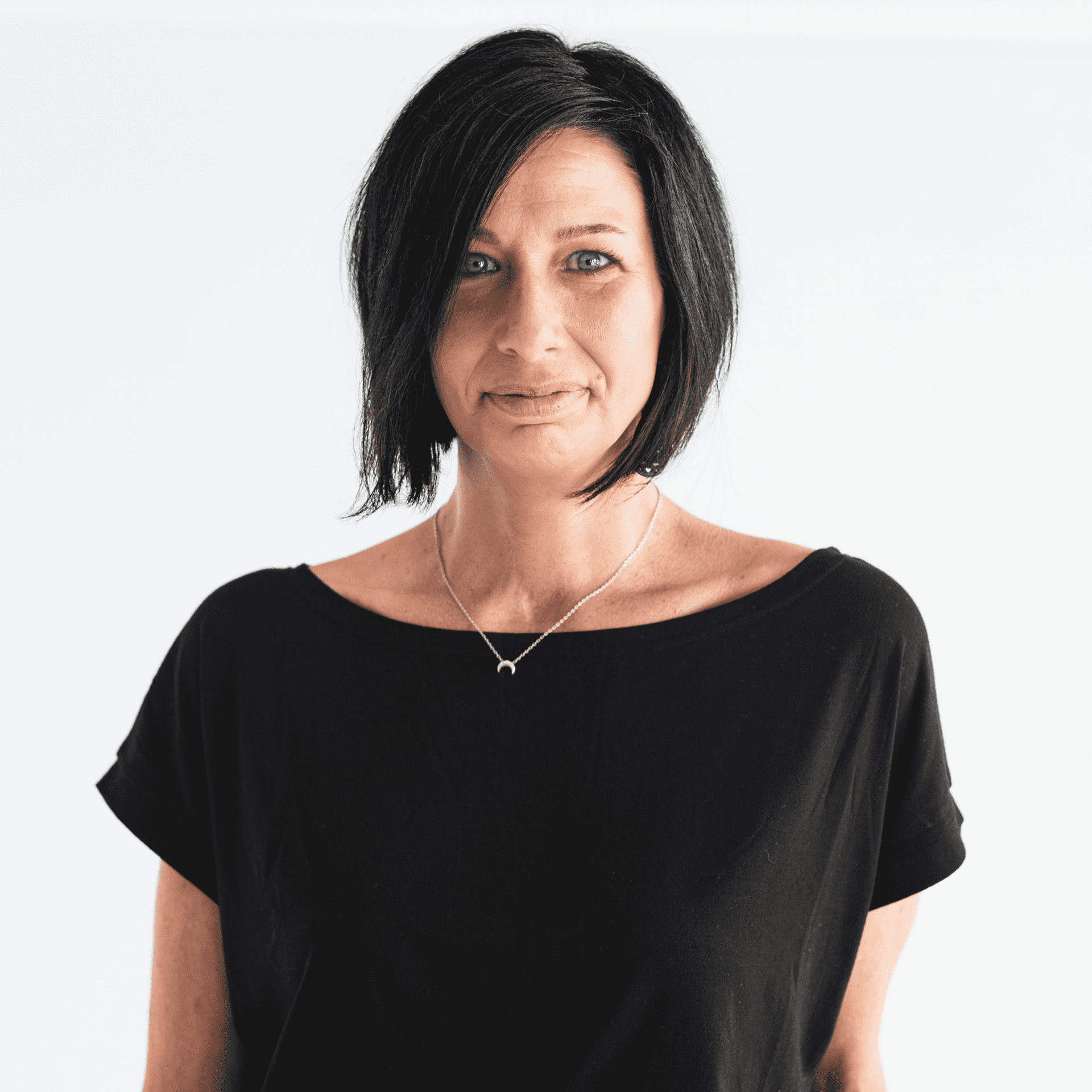Portrait of Eleisha Kavulich, a professional stylist at The Capital Salon & Suites, showcasing their expertise and style.