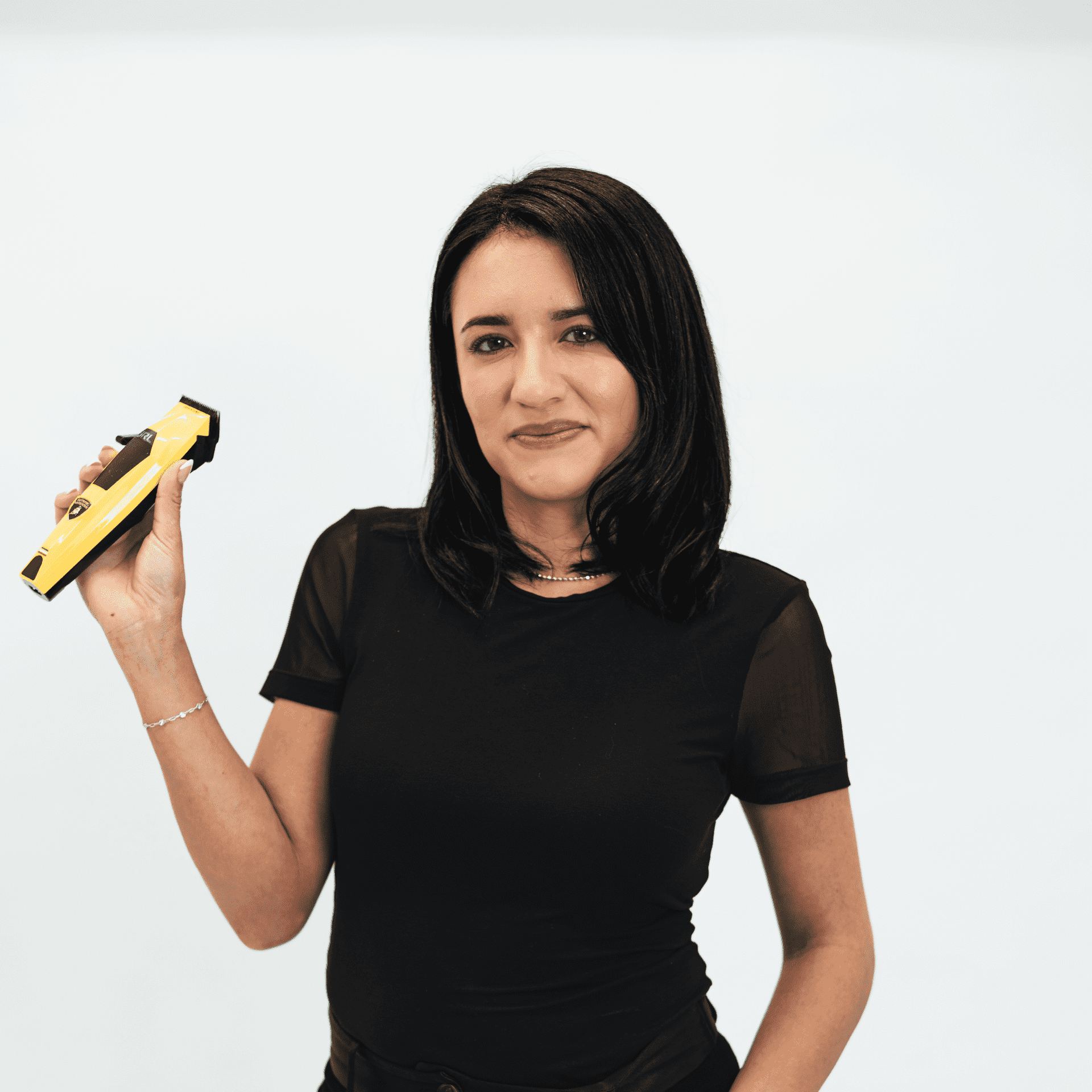 Portrait of Sandra Jarvies, a professional stylist at The Capital Salon & Suites, showcasing their expertise and style.