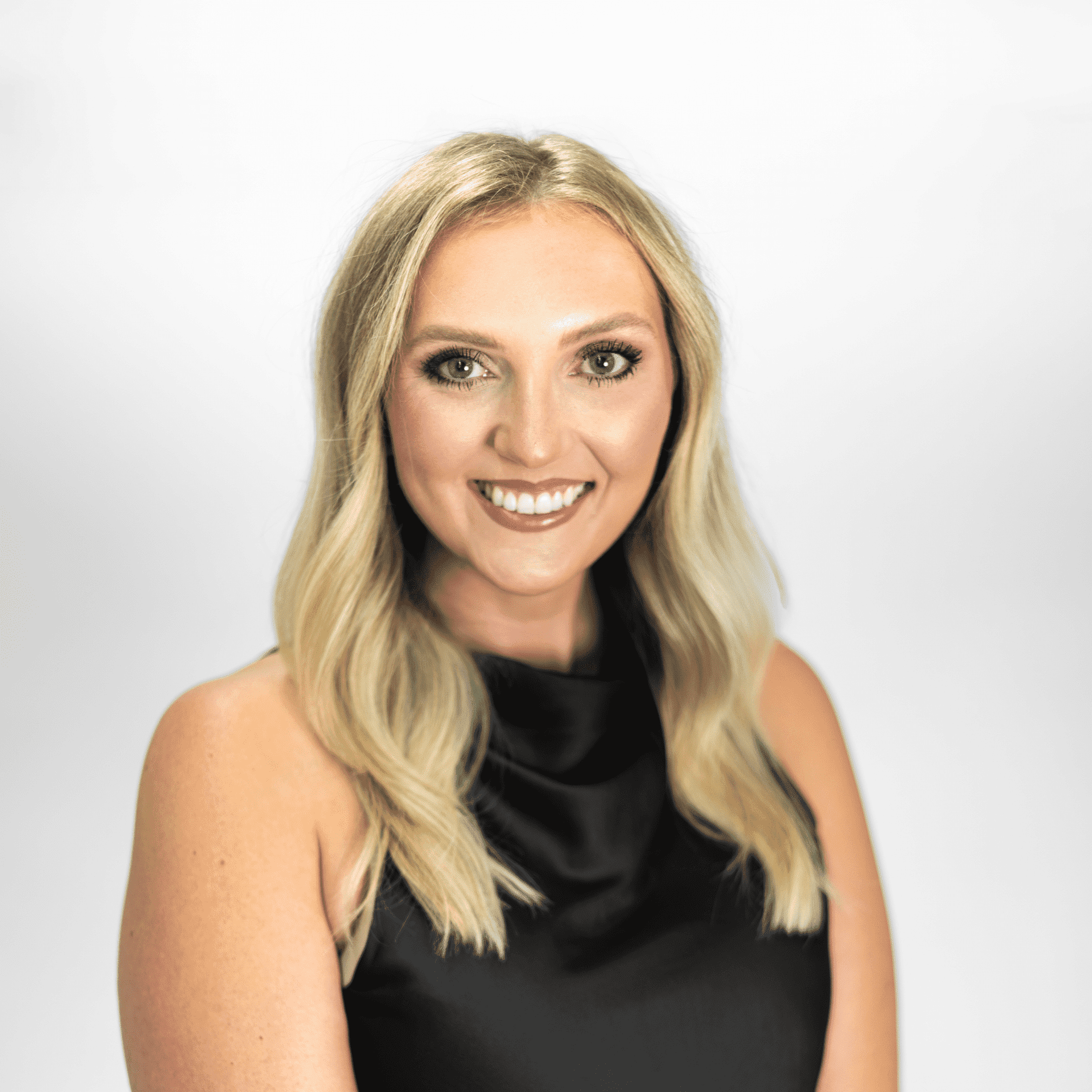 Portrait of Kaitlyn Sherrod, a professional stylist at The Capital Salon & Suites, showcasing their expertise and style.