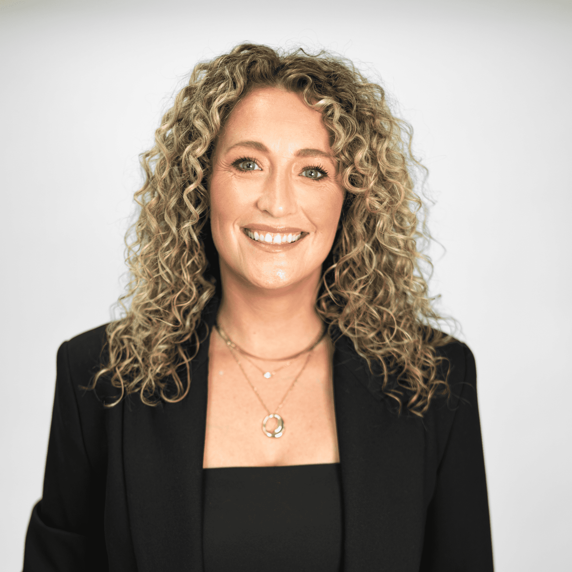 Portrait of Micka Counts, a professional stylist at The Capital Salon & Suites, showcasing their expertise and style.