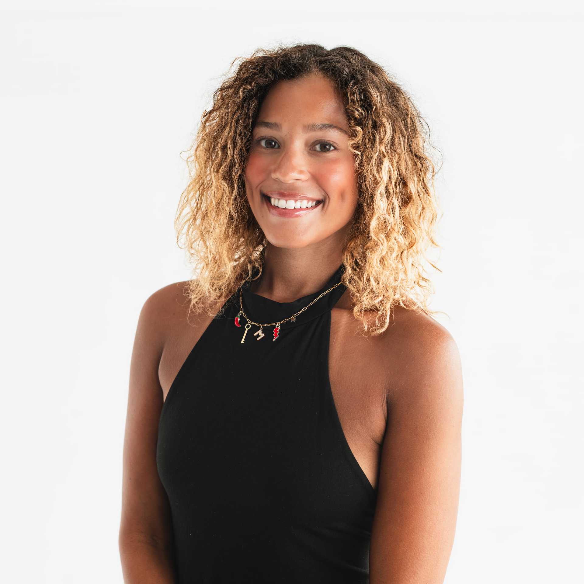 Portrait of Makenna Johnson, a professional stylist at The Capital Salon & Suites, showcasing their expertise and style.