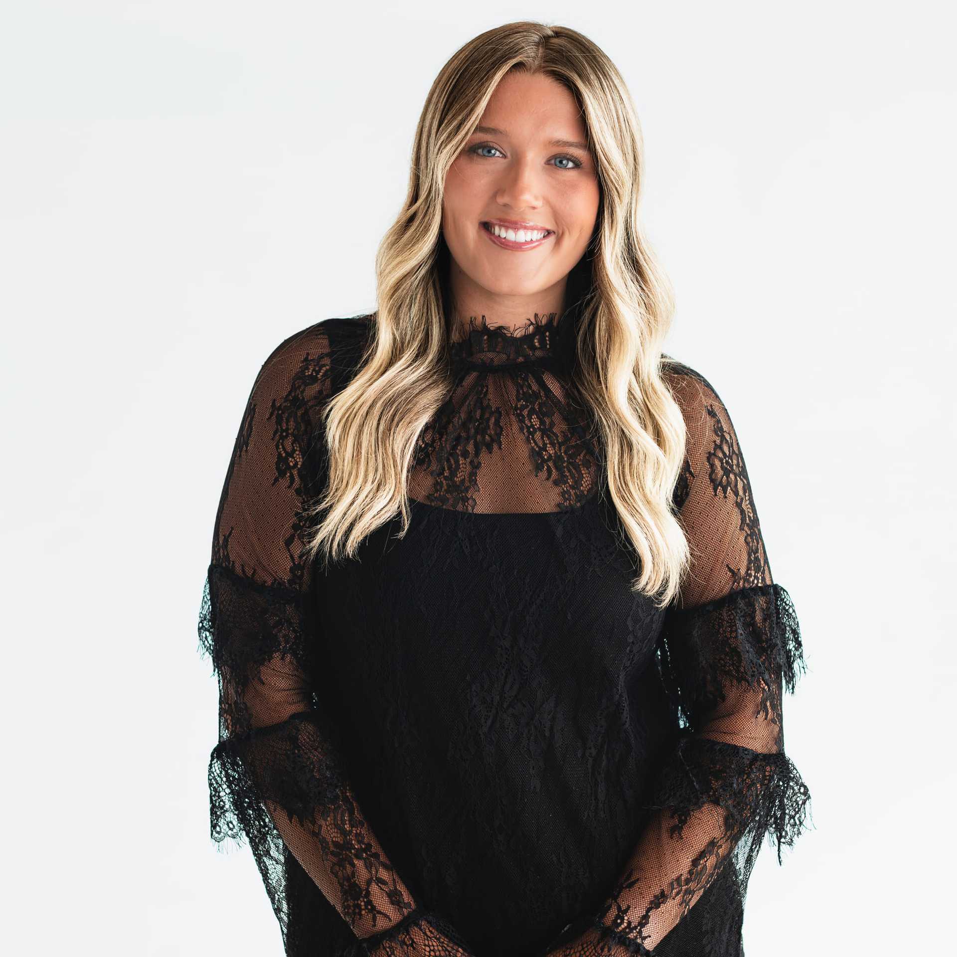 Portrait of Kiki Cantrell, a professional stylist at The Capital Salon & Suites, showcasing their expertise and style.