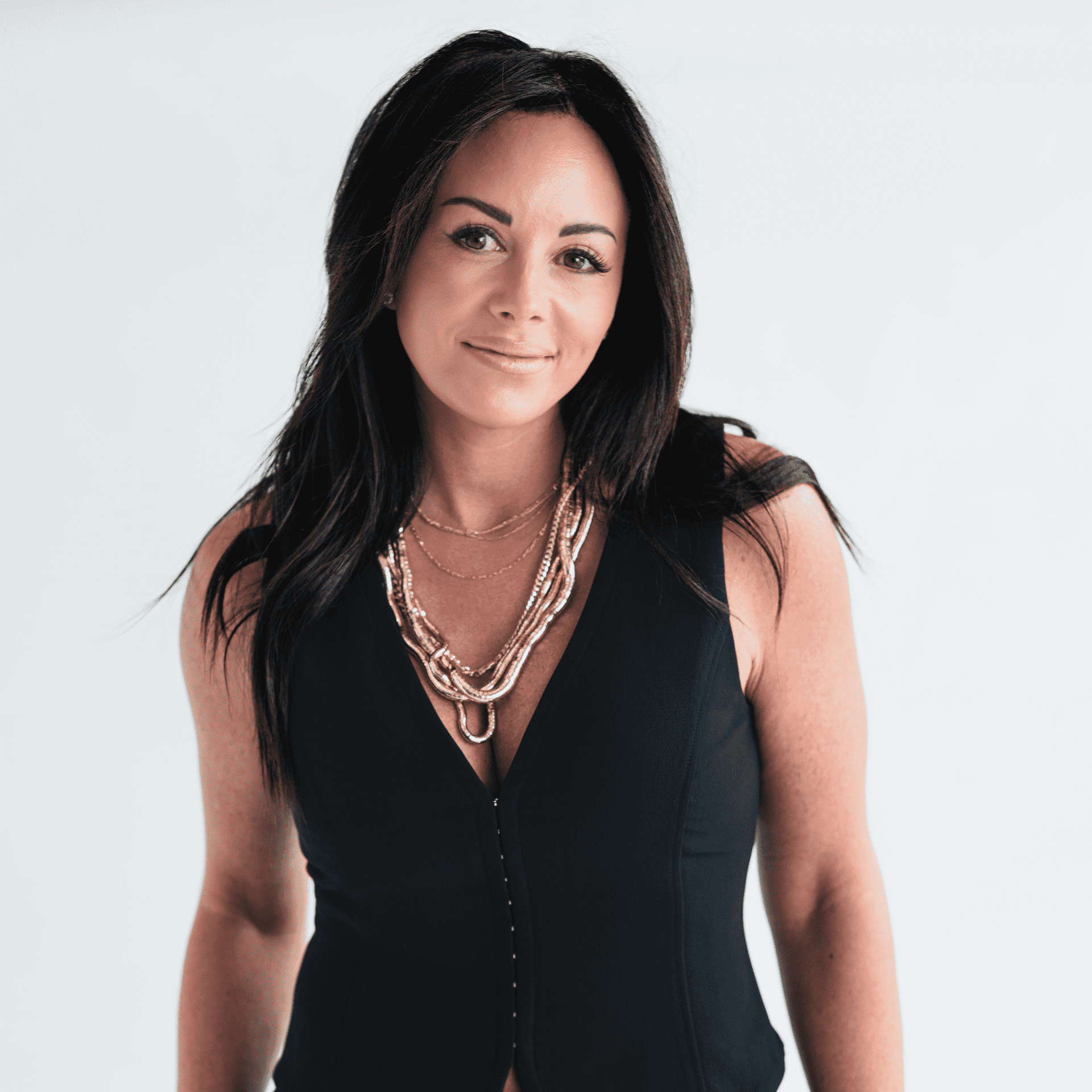 Portrait of Nikki Gibson, a professional stylist at The Capital Salon & Suites, showcasing their expertise and style.