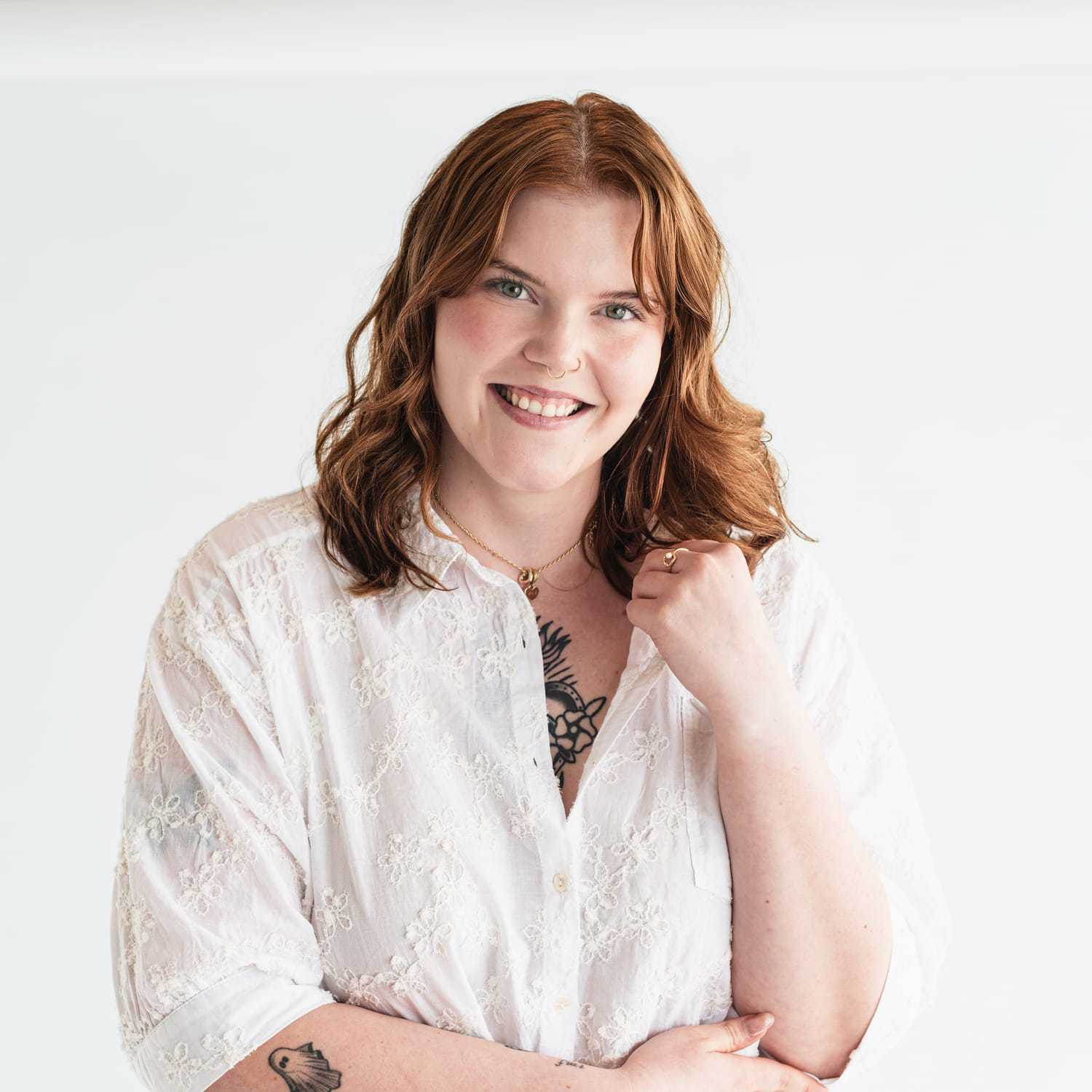 Portrait of Liz Farrow, a professional stylist at The Capital Salon & Suites, showcasing their expertise and style.