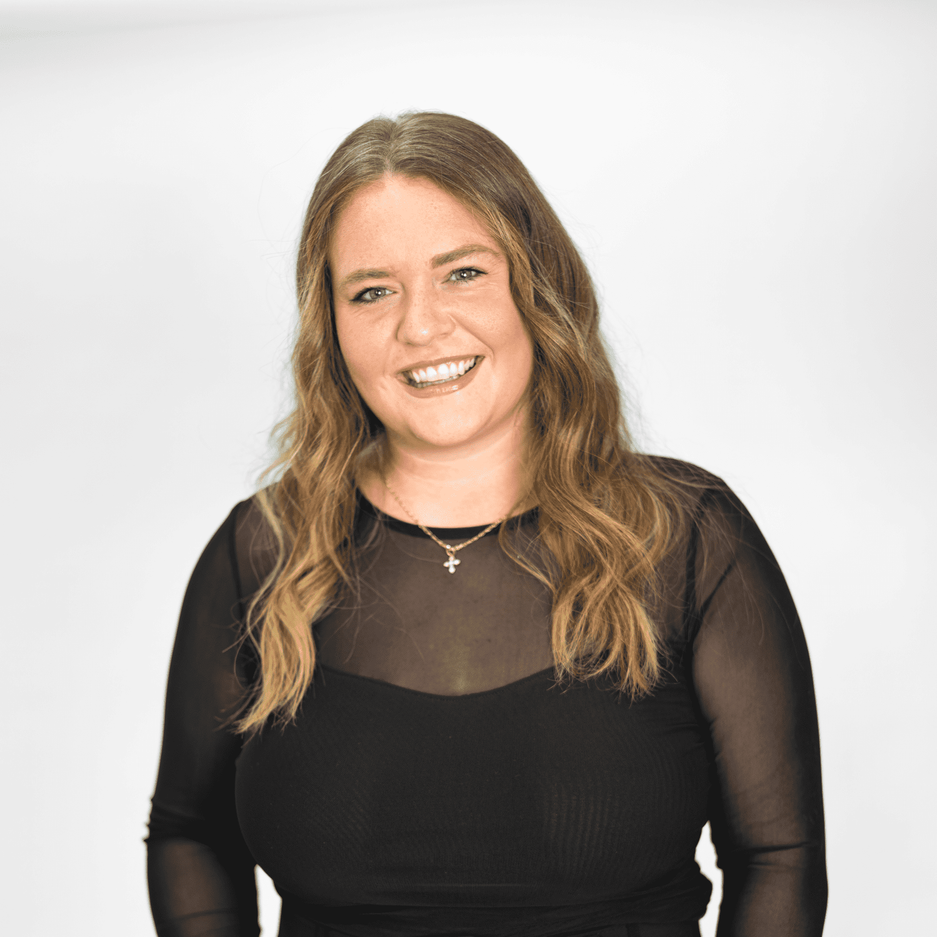 Portrait of Alexis Batson, a professional stylist at The Capital Salon & Suites, showcasing their expertise and style.