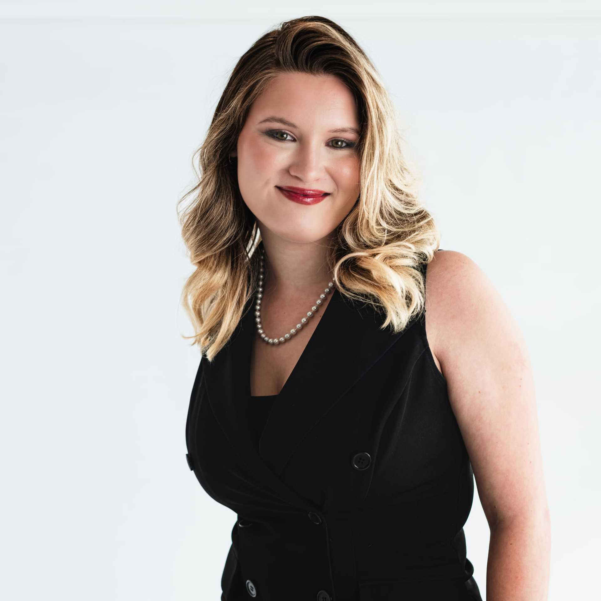 Portrait of Kristen Roark, a professional stylist at The Capital Salon & Suites, showcasing their expertise and style.