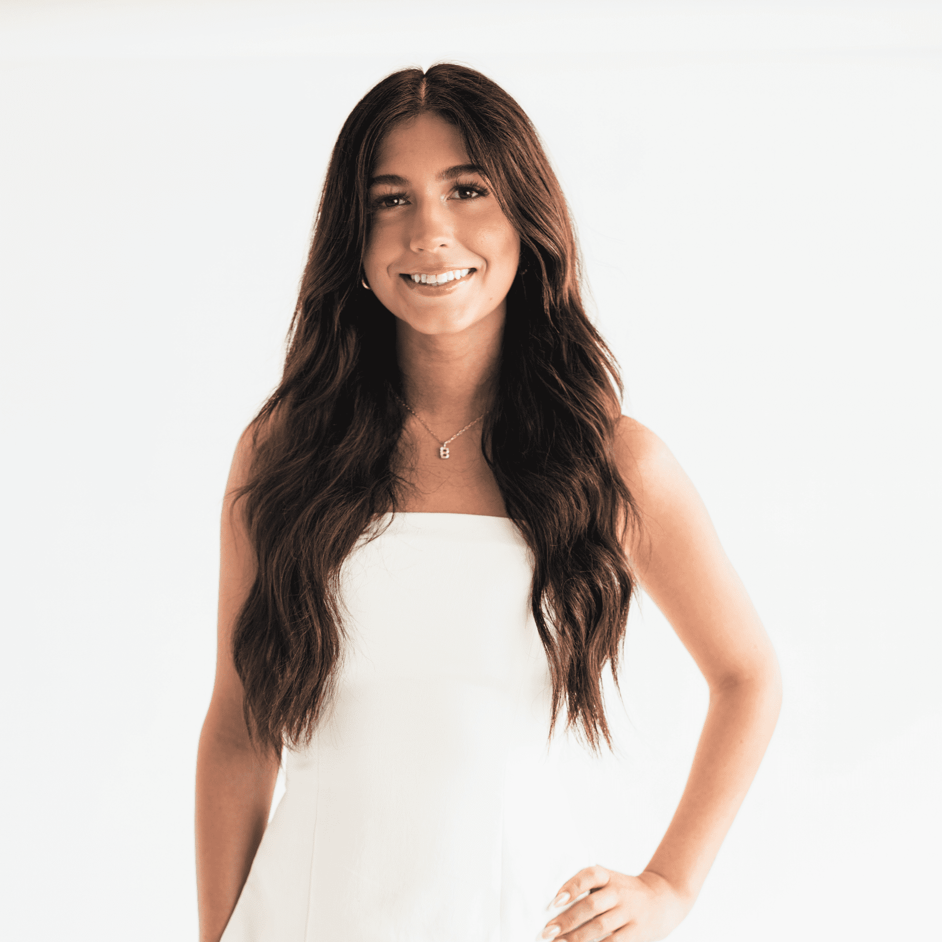 Portrait of Kyndal Caudill, a professional stylist at The Capital Salon & Suites, showcasing their expertise and style.