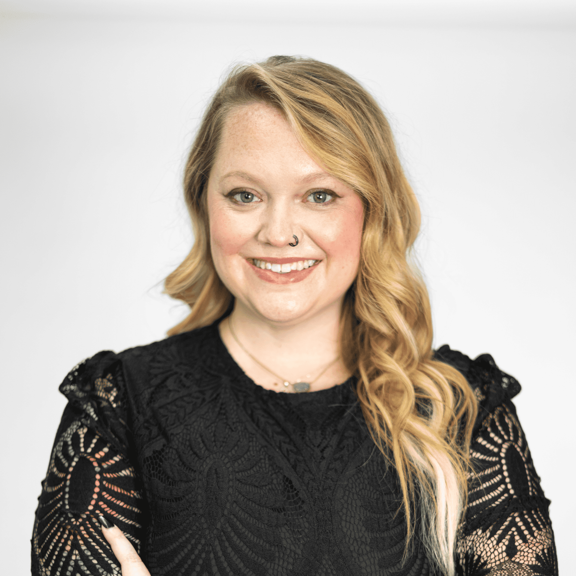 Portrait of Taylor Baker, a professional stylist at The Capital Salon & Suites, showcasing their expertise and style.