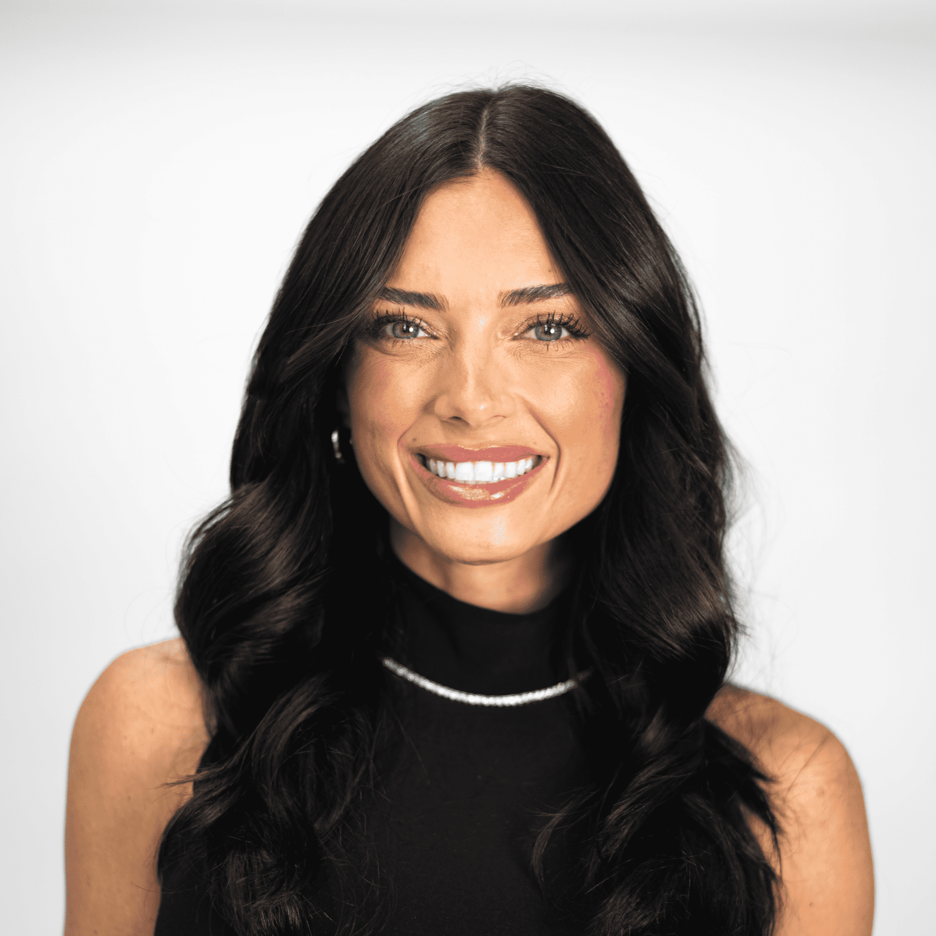 Portrait of Natalie Herren, a professional stylist at The Capital Salon & Suites, showcasing their expertise and style.
